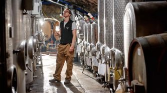 Johannes Hasselbach stands in the Gunderloch cellars. Few people can work in the small space right now with social distancing rules. (Chris Janik)