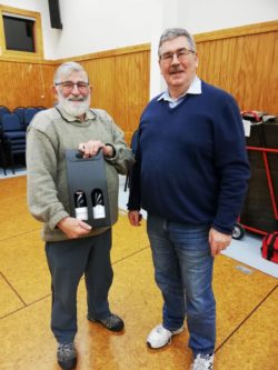 Robin Semmens presented with a wine box set from Wayne Kennedy