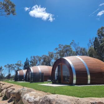 Barrel View Luxury Cabins in Ballandean are designed to look like giant halved wine barrels.